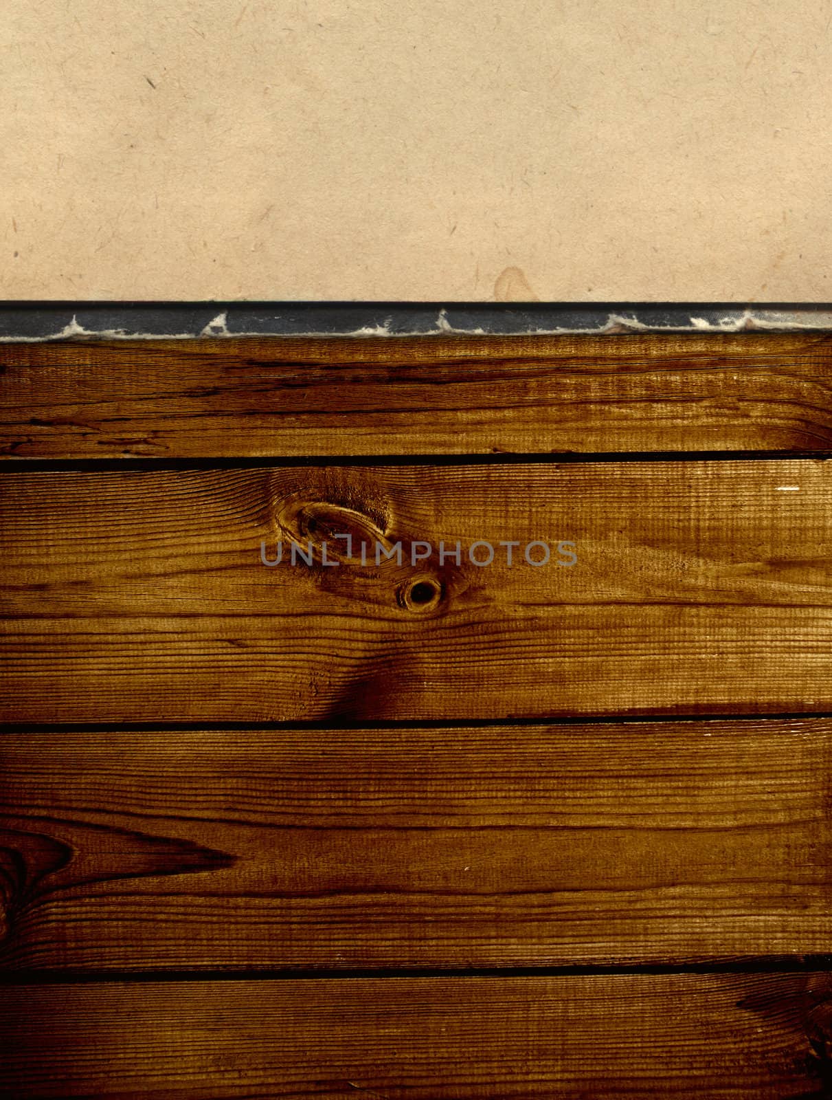 Old book on wooden planks