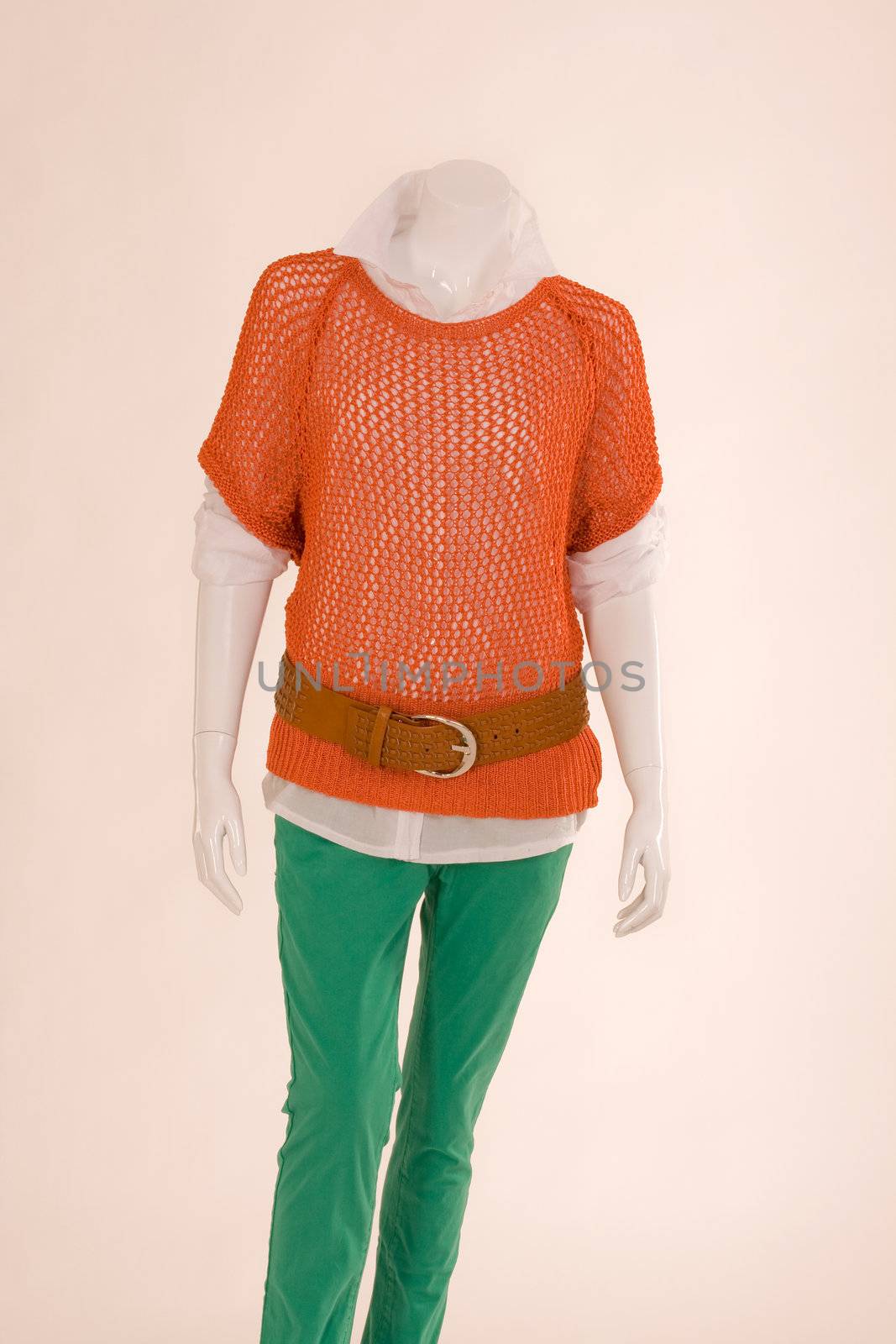 Mannequin dressed with a scarf, jacket, shirt and green pants