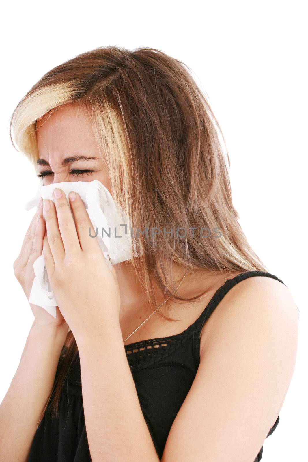 Closeup of gorgeous caucasian woman with cold sneezing into tiss by dacasdo