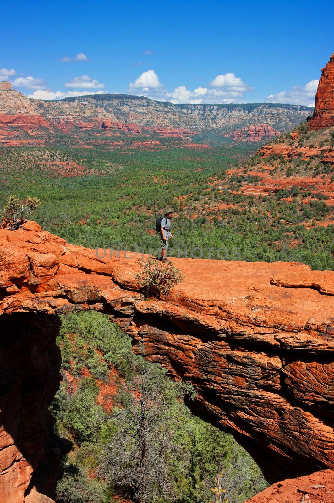 Man hiking at Devils Bridge in Sedona Arizona