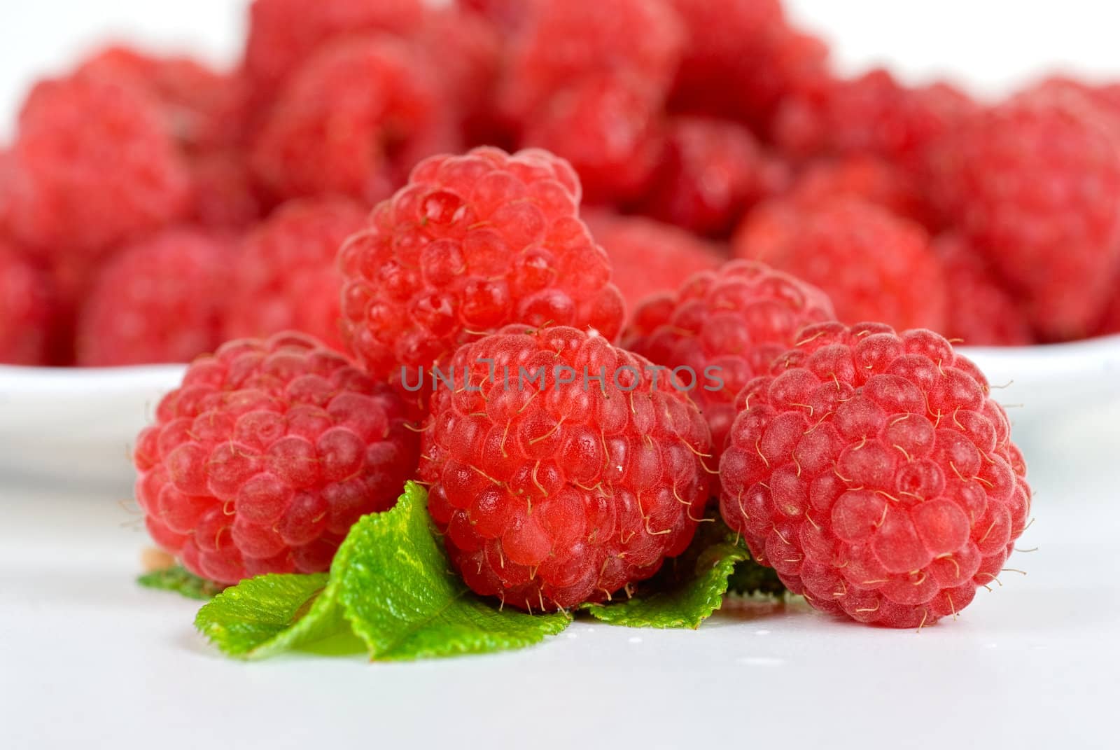 fresh raspberry closeup on a white background