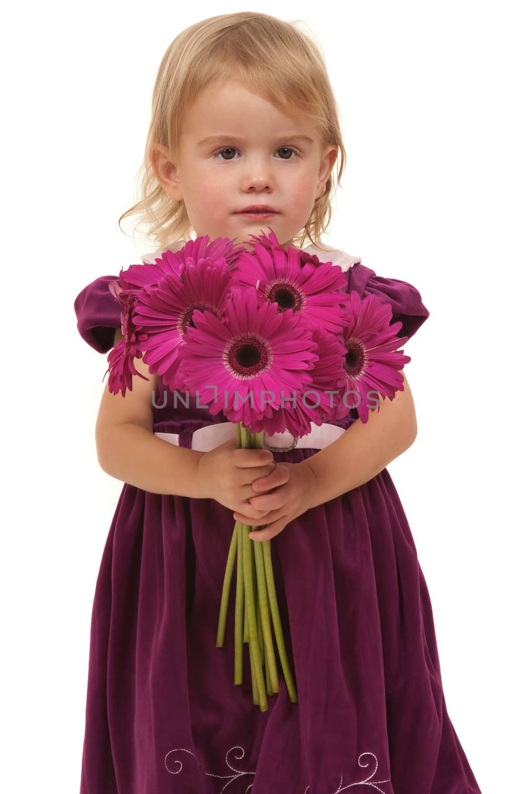 Beautiful little girl giving flowers 