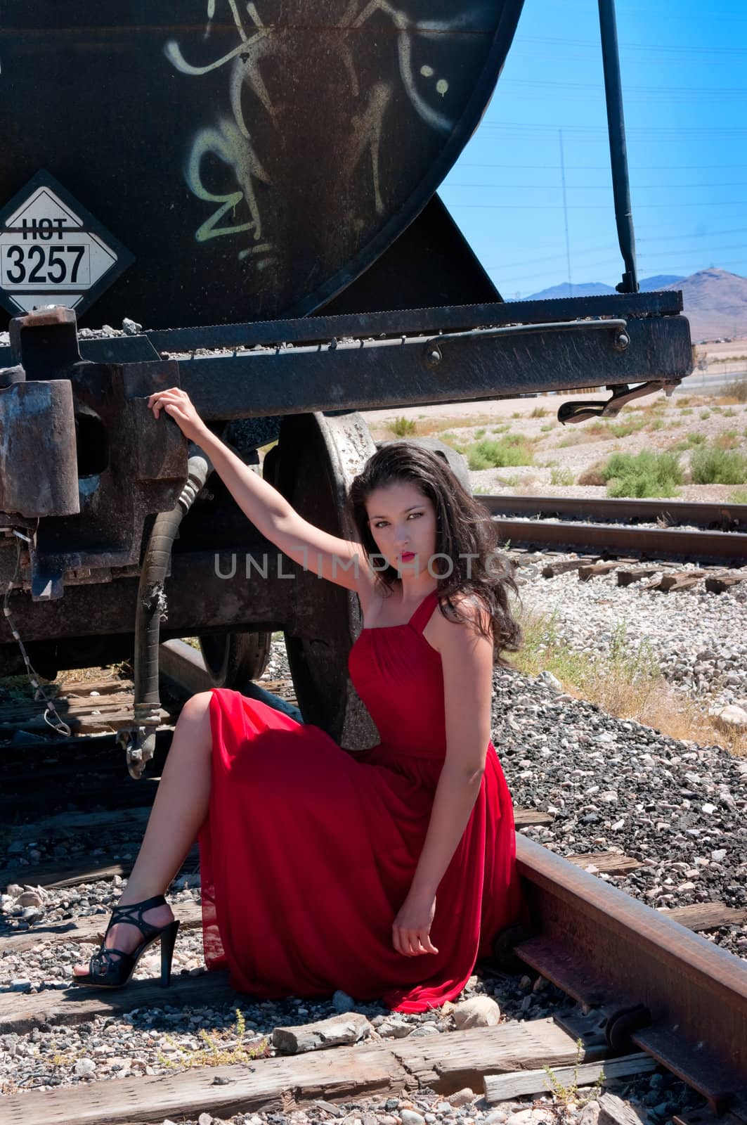 Fashion model with a designer red dress 