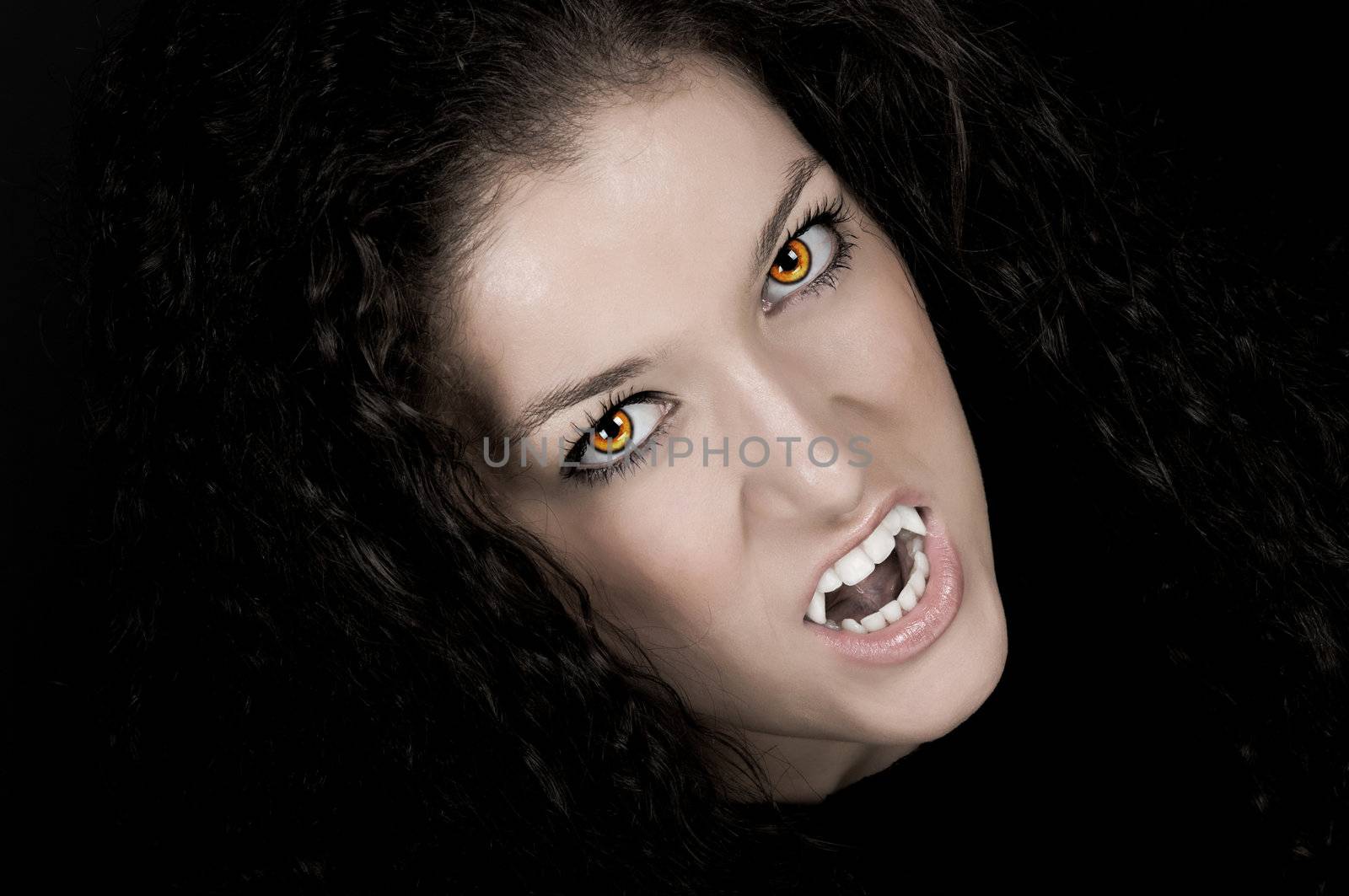 Vampire with pale face, fangs, and scary eyes