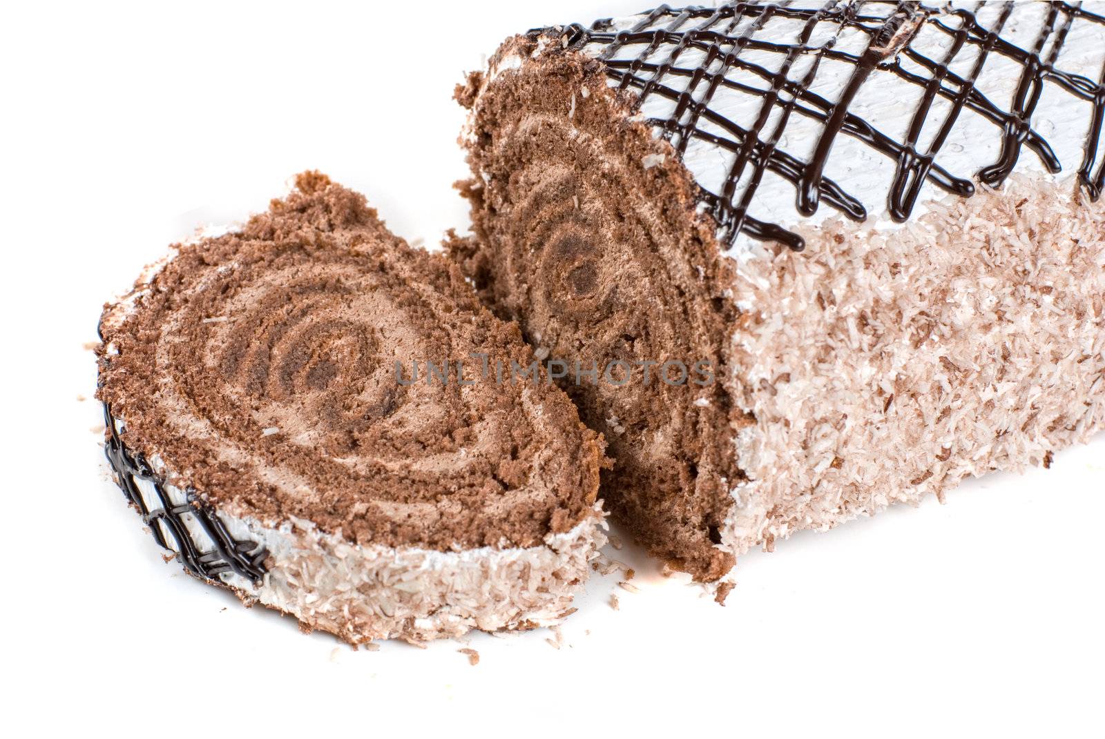 Chocolate Swiss roll closeup isolated on a white background