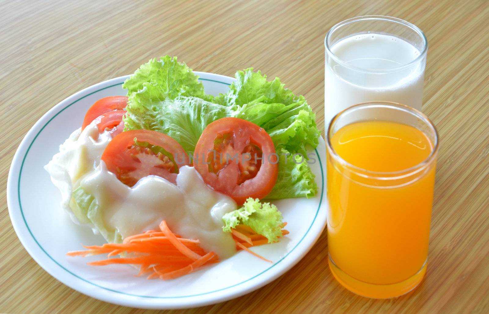 fresh  breakfast ,  fresh vegetables , milk and orange juice