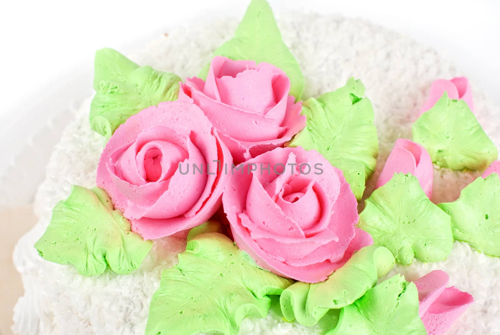 cream cake closeup with cherry on a grey