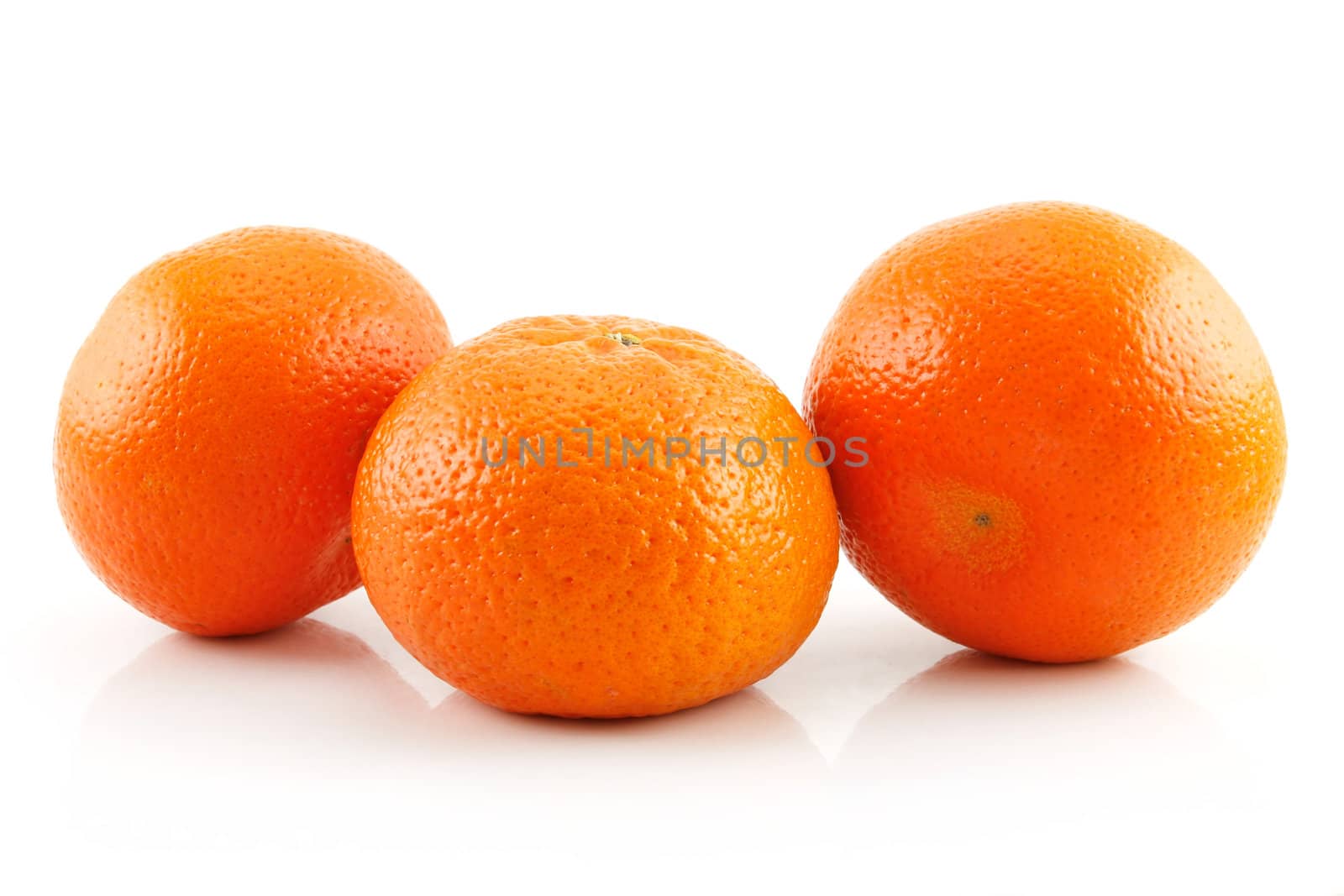 Three Ripe Tangerine Fruits Isolated on White by alphacell