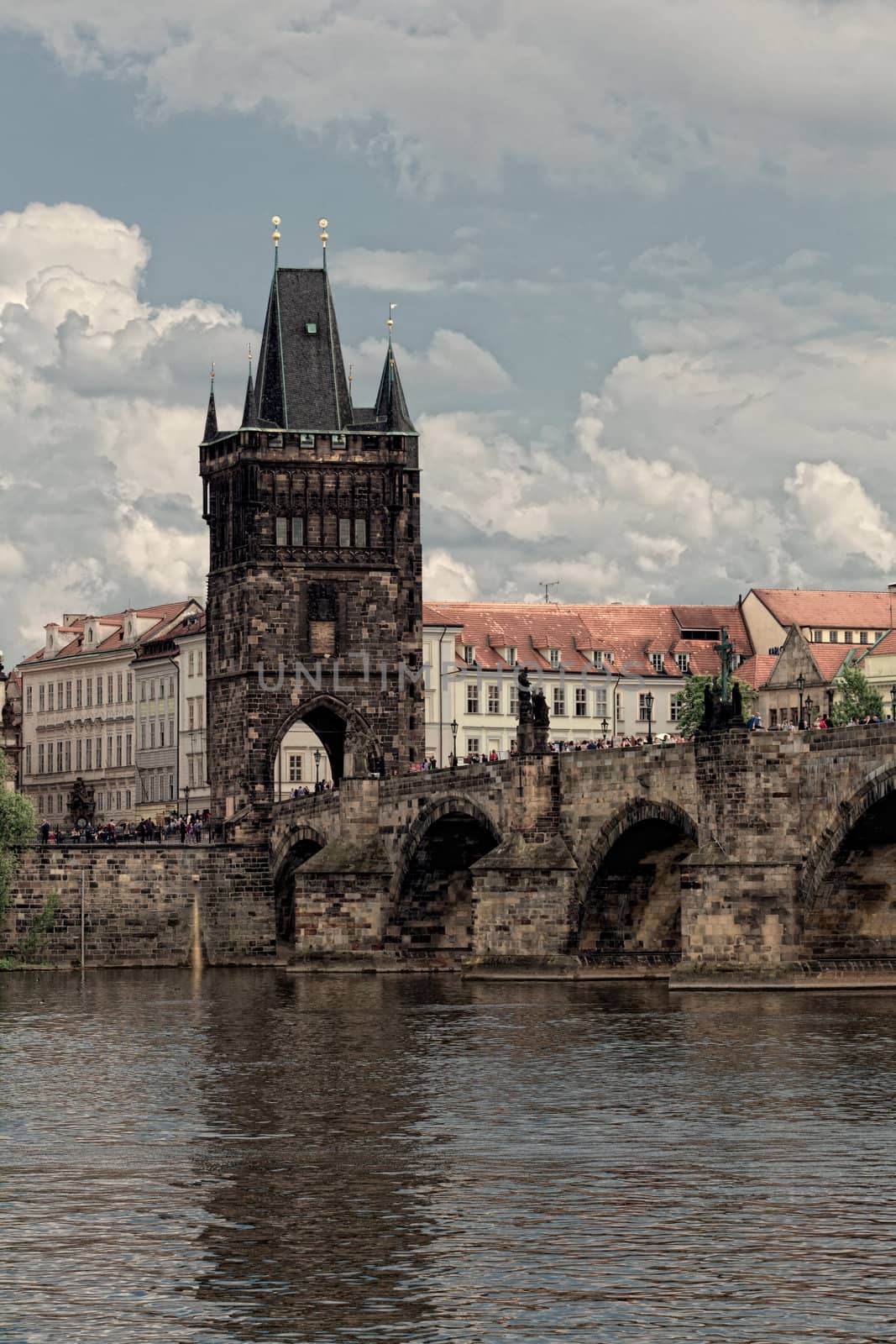 Prague, view of Karlov Bridge and tourists going on it