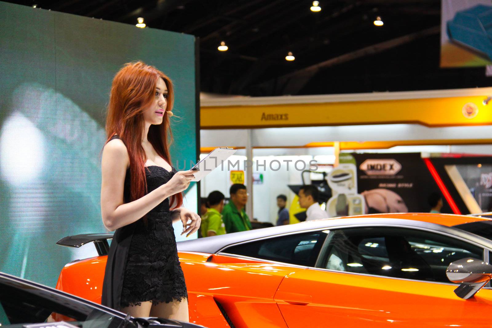 BANGKOK, THAILAND - April 2- Pretty girl presents new car in Bangkok international motor show 2013 on April 2, 2013 in Bangkok, Thailand.