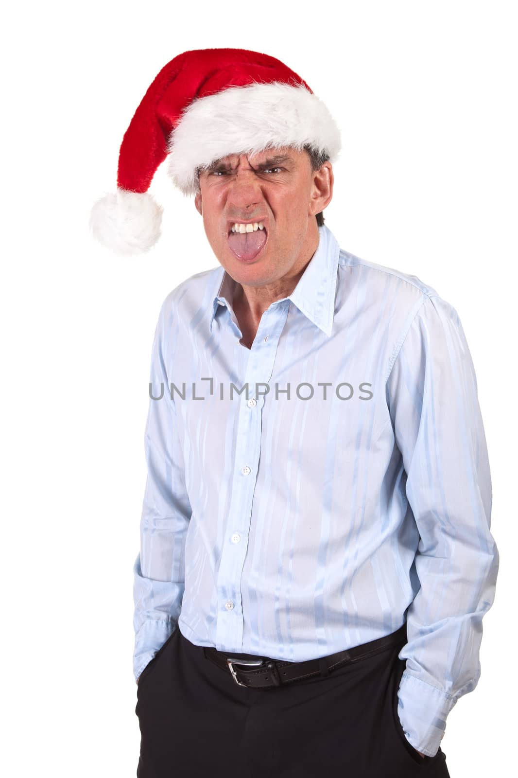 Grumpy business man in Santa Hat poking out tongue by scheriton