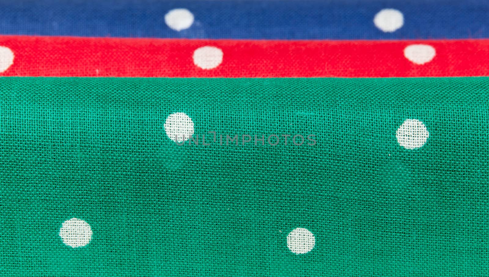 Folder linen handkerchiefs in red blue and green with white spots