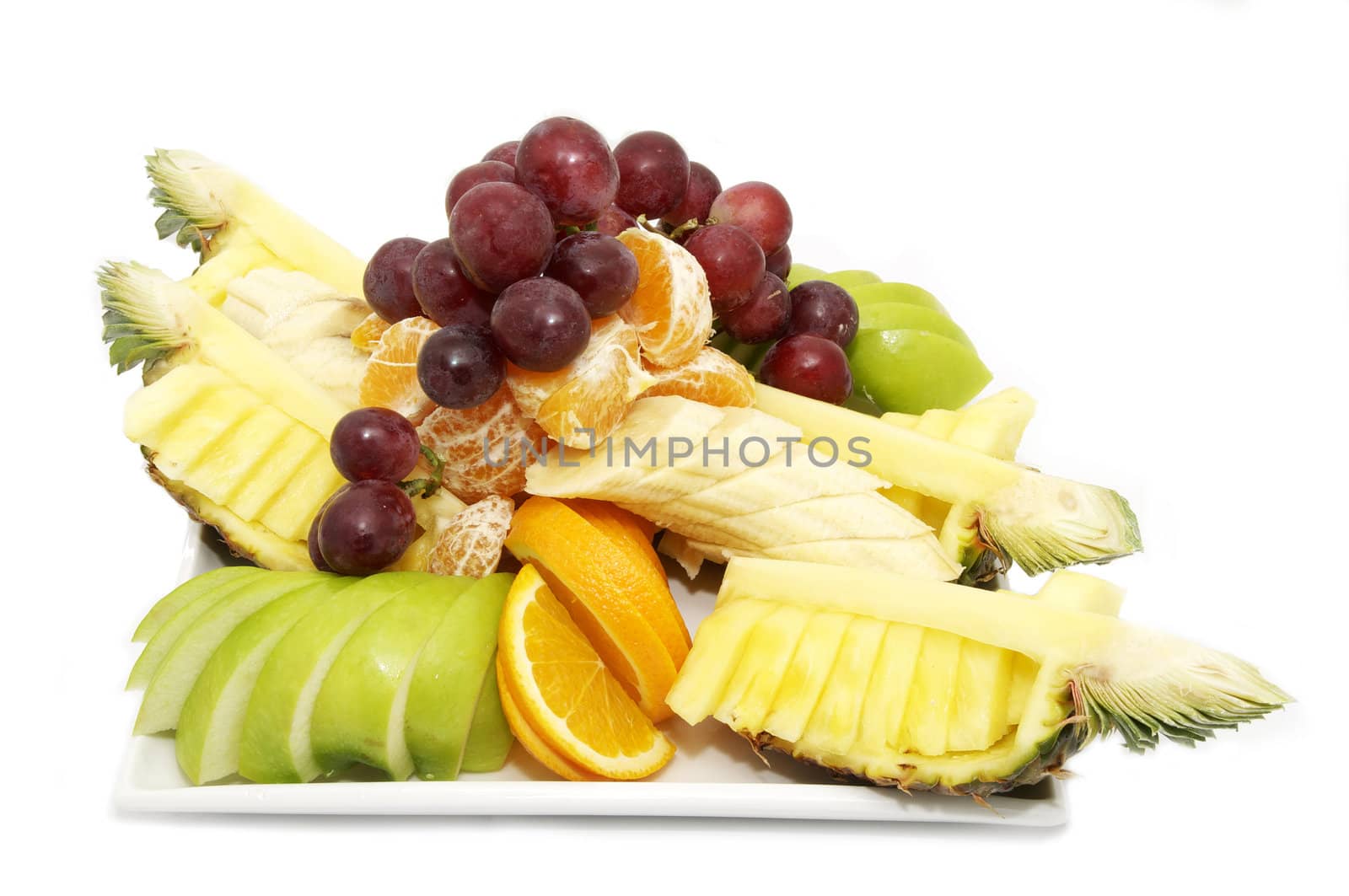 a huge bowl of fruit on a white background