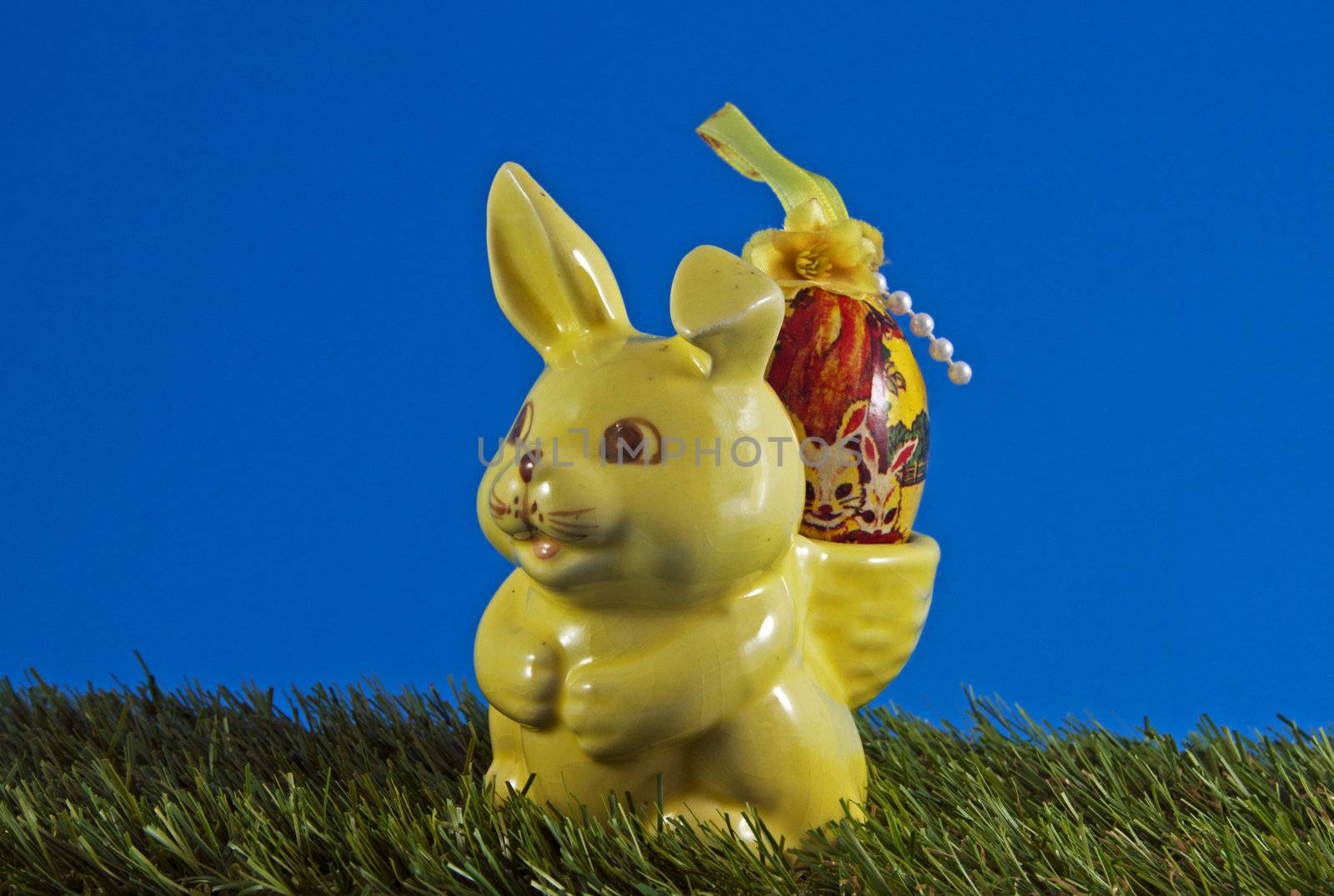 easter bunny with eggs on green grass