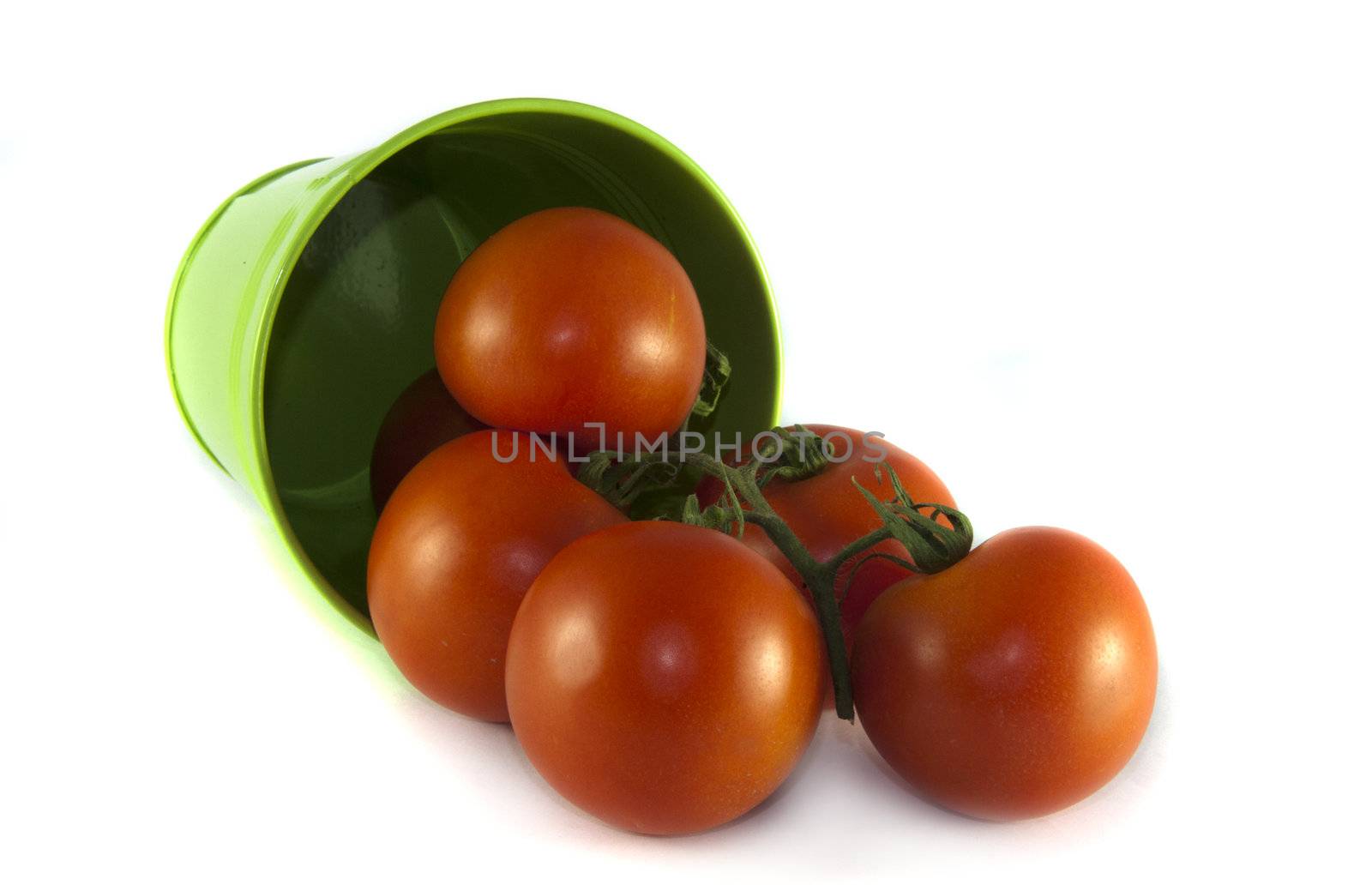 green container with red tomatoes on isolated white background