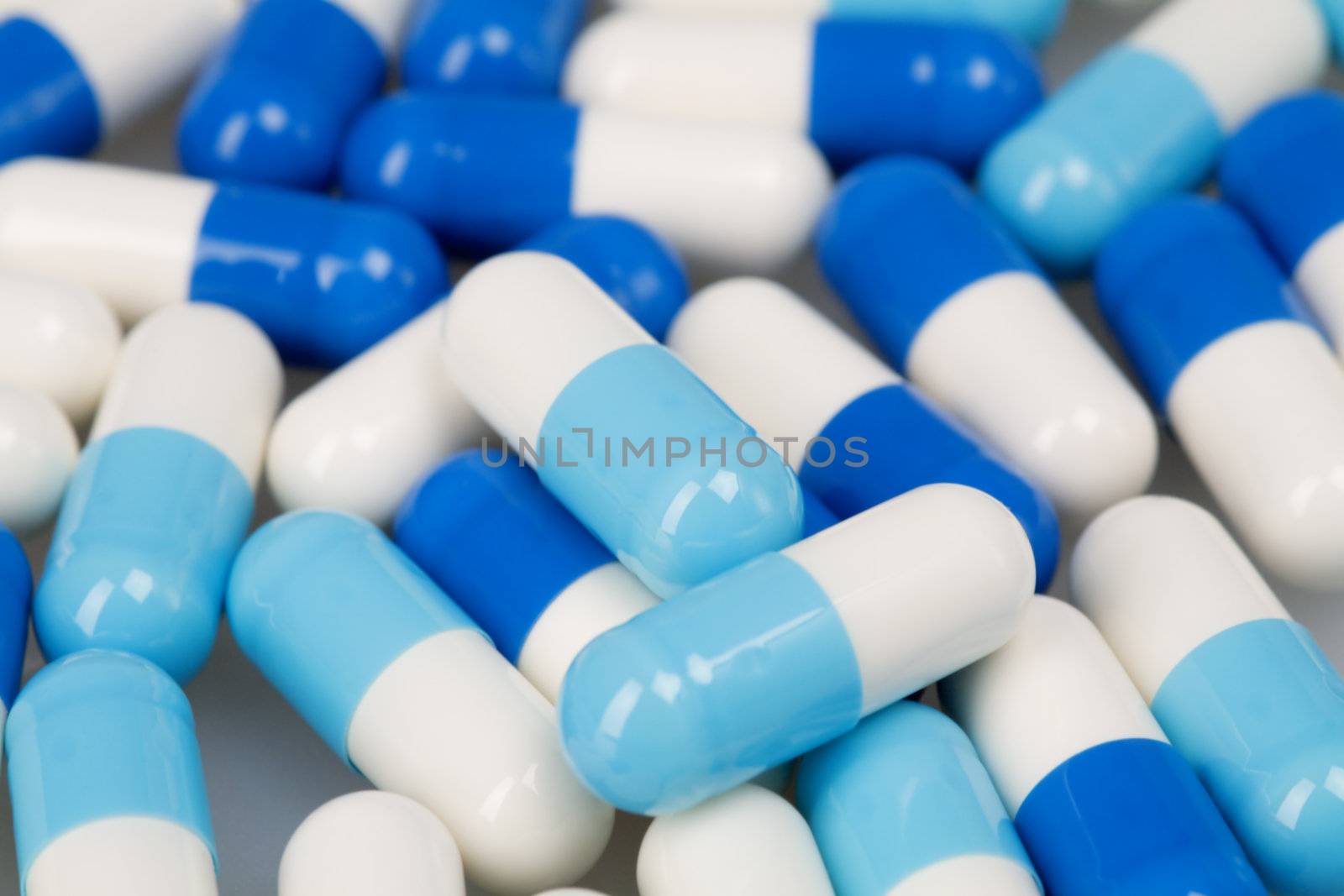 Set of white blue tablets as a background on medical subjects