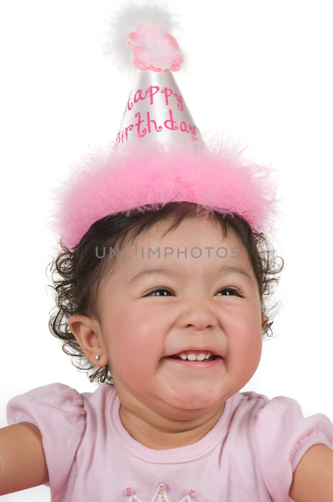 Baby with a big smile on her first birthday party