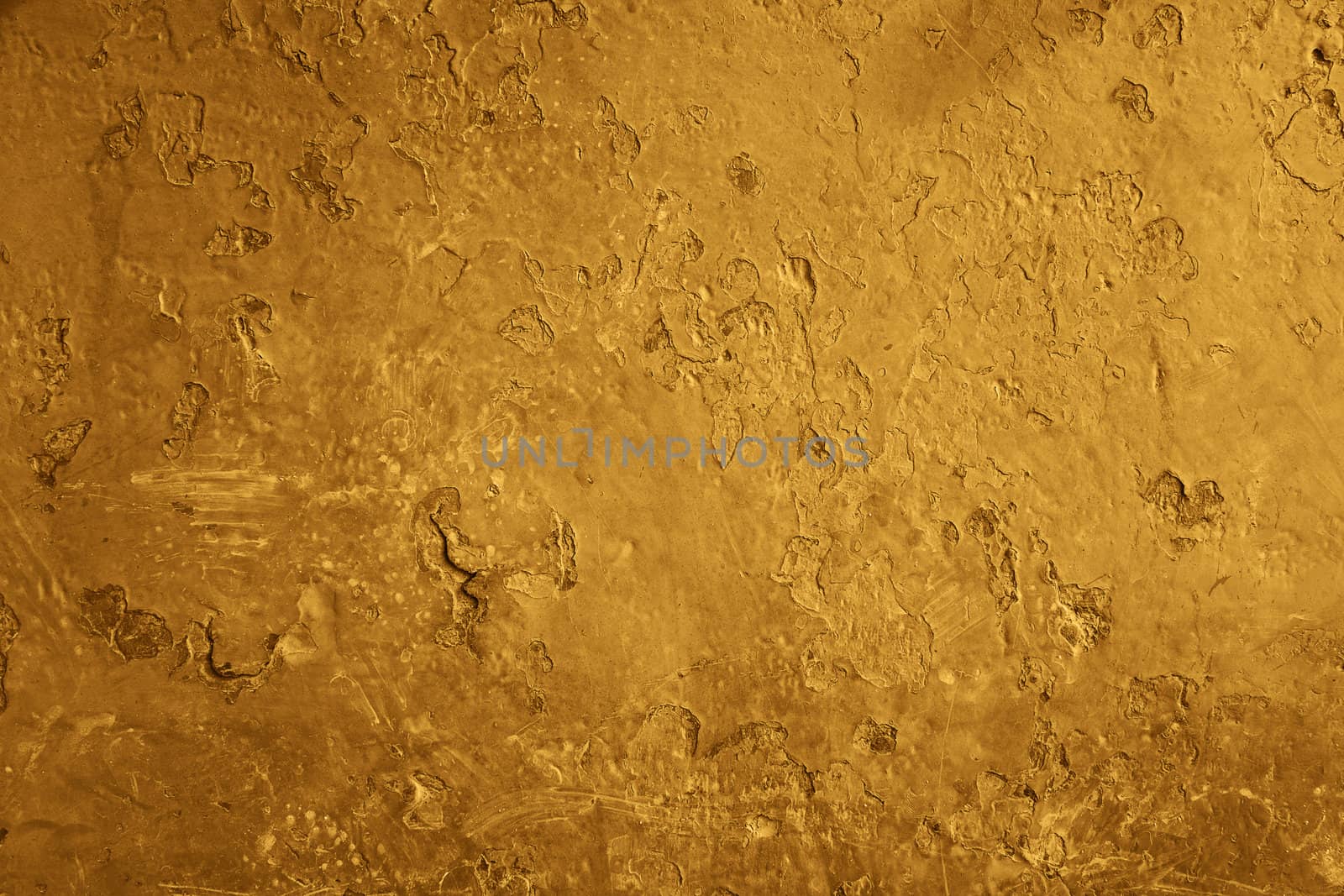 old brown wall with visible cracks and hollows