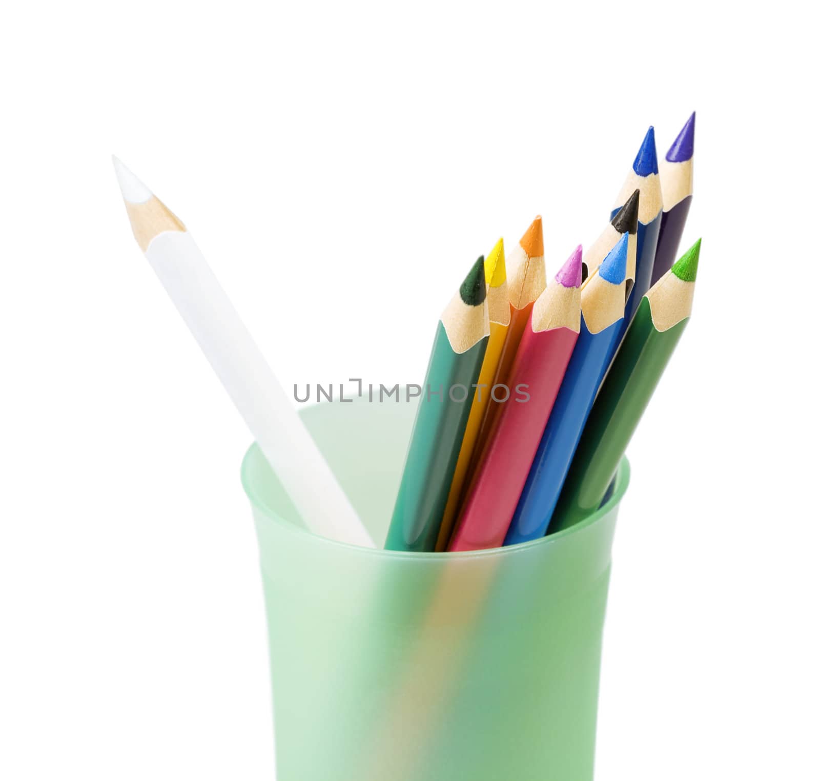 Color pencils in a glass on a white background