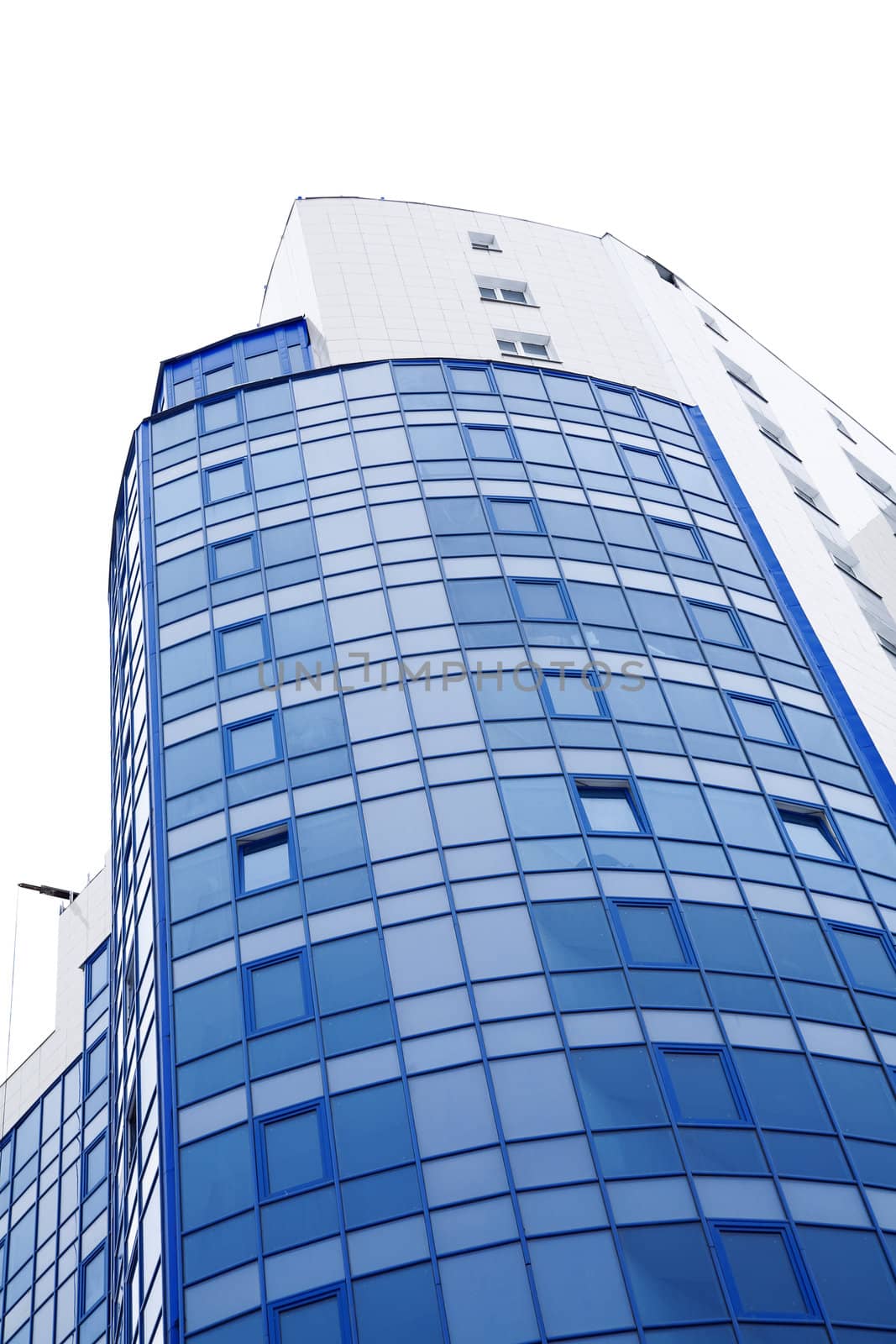 Blue windows of a high modern building on a white background