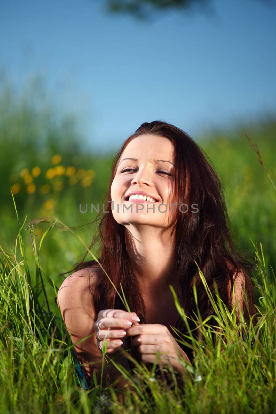  happy woman lay on green grass