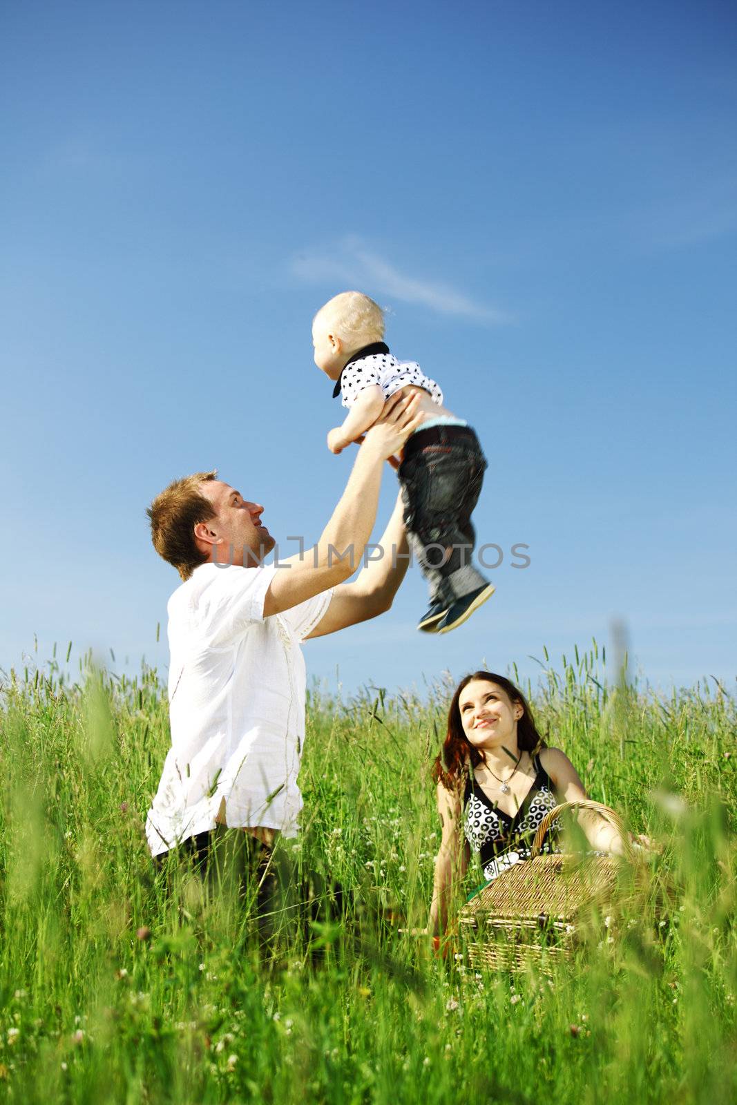 happy family in green grass