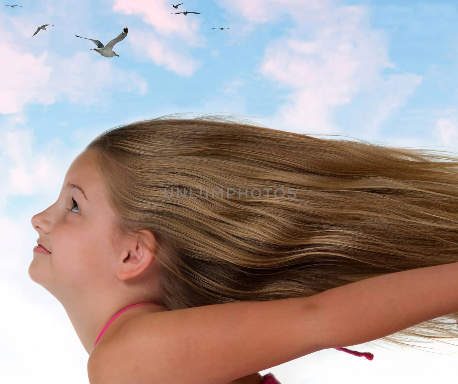 Girl flying through the clouds