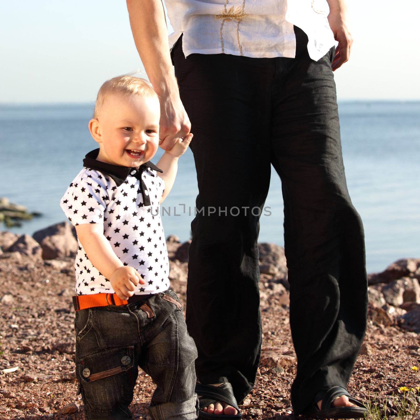 father and son walking on grass