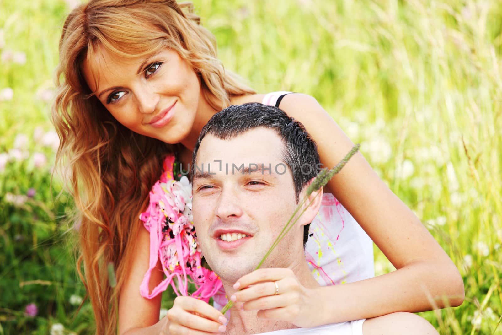 two lovers on grass field