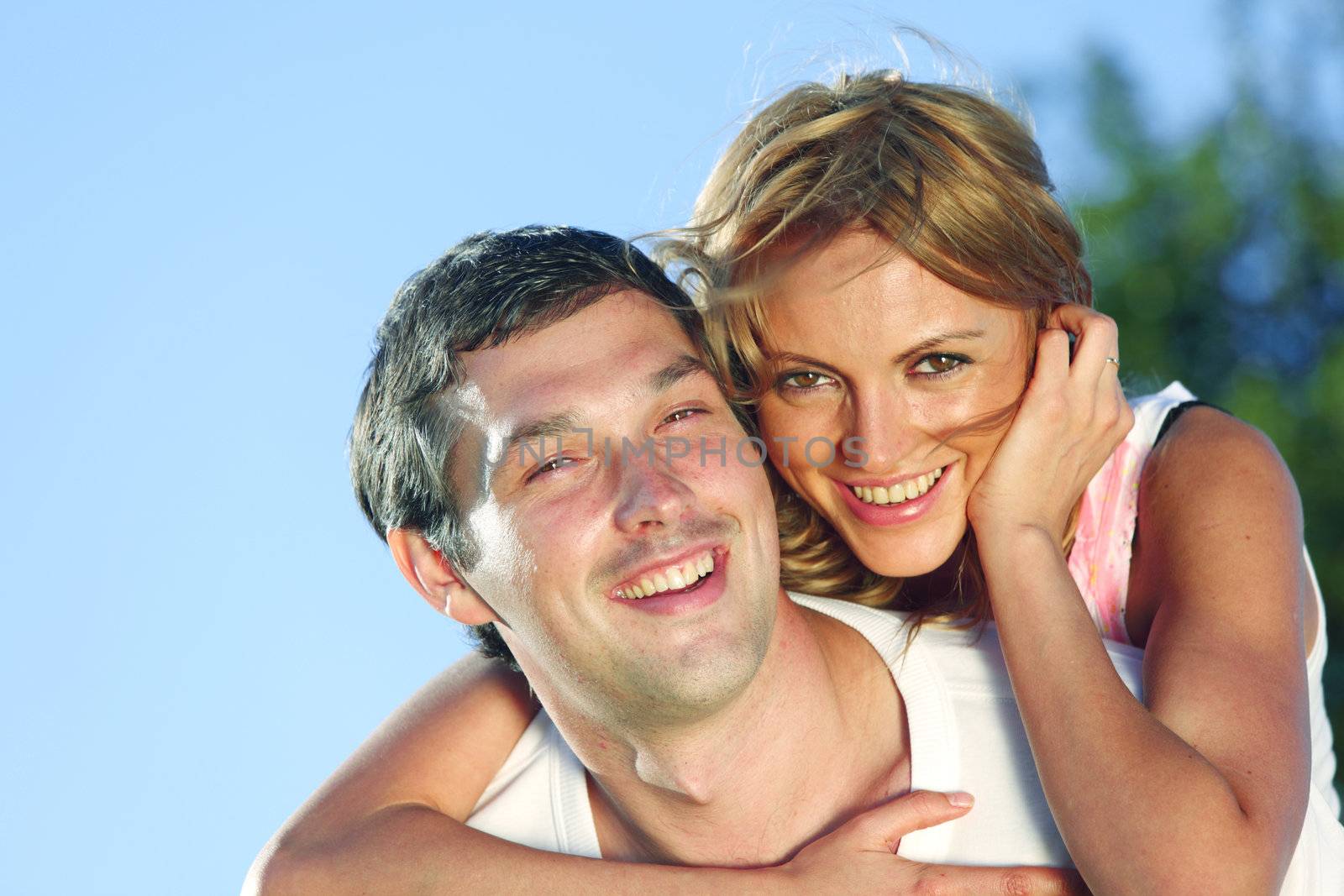 man and woman hug in the sky