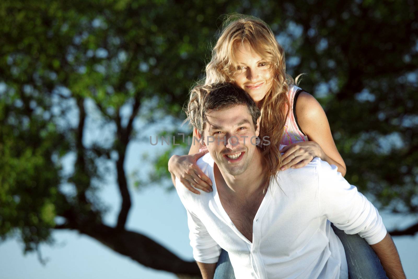 man and woman hug in the sky
