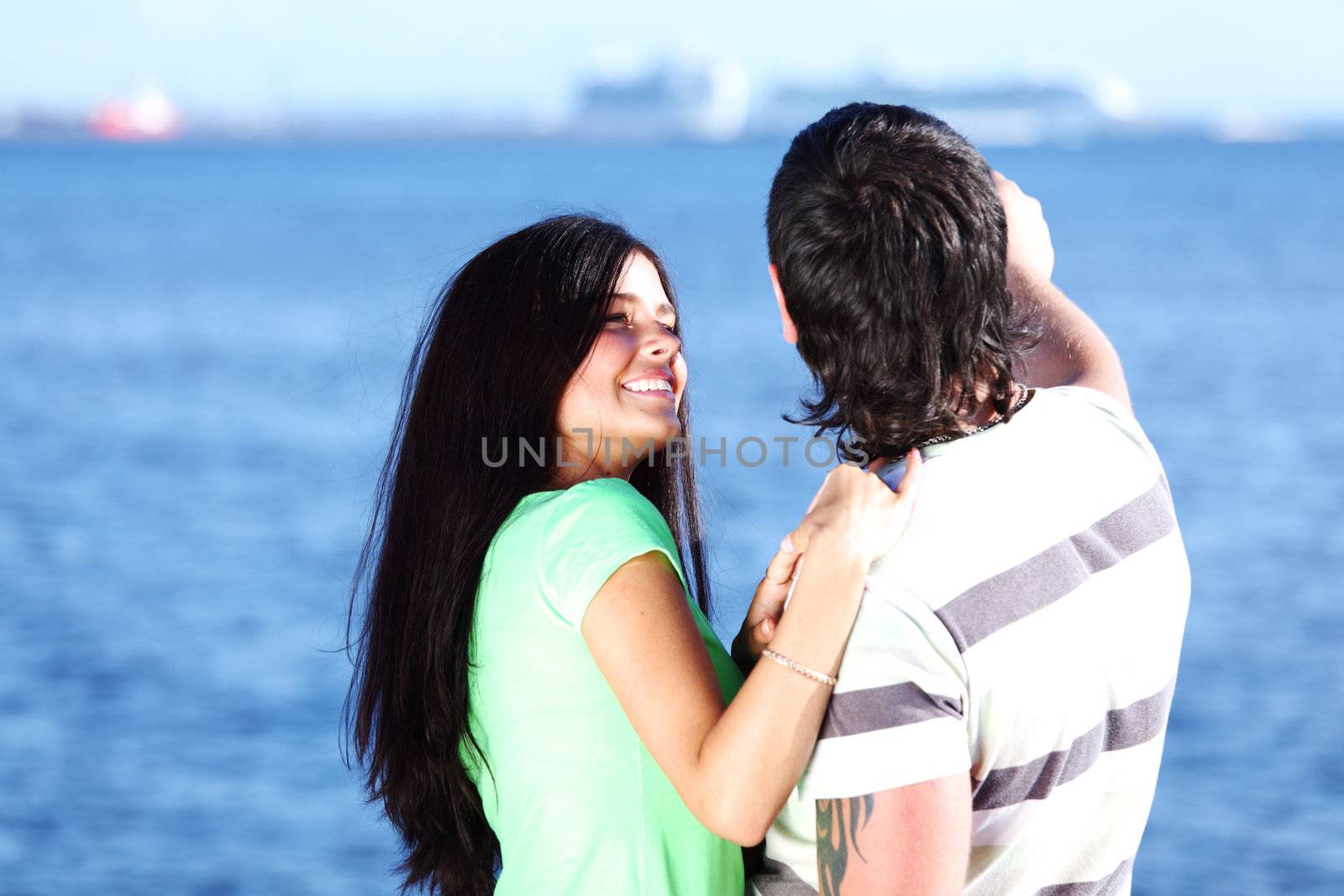 man and woman hug in the sky sea on background