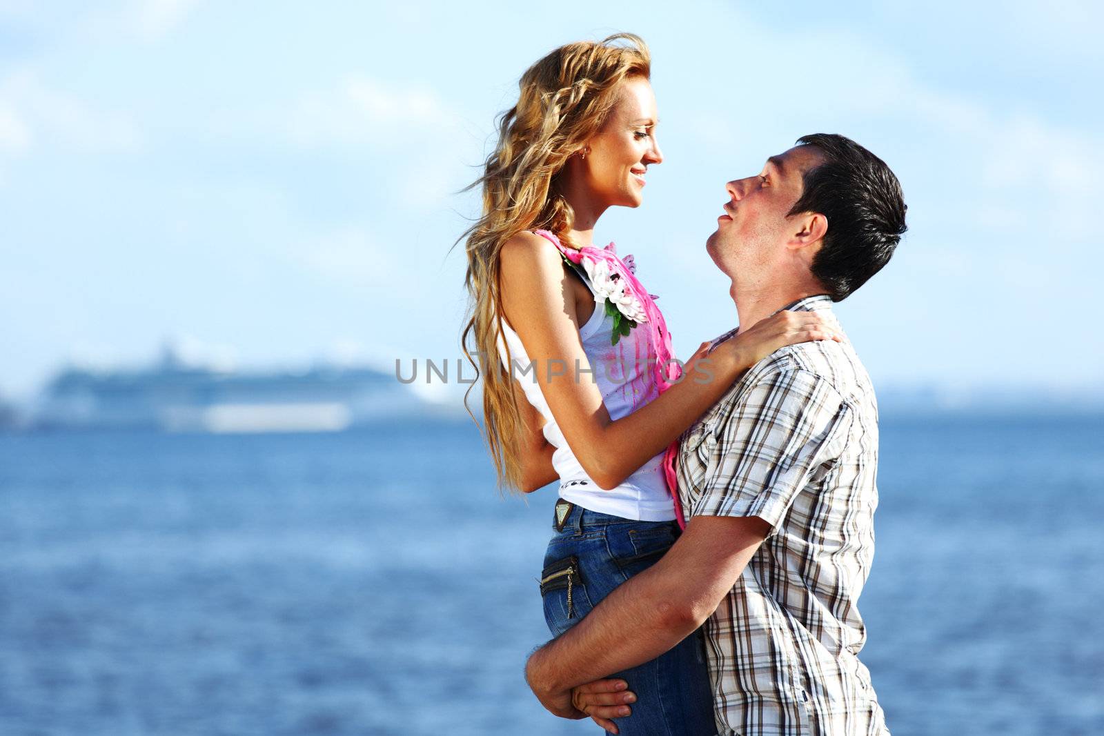 man and woman hug in the sky and sea on sea