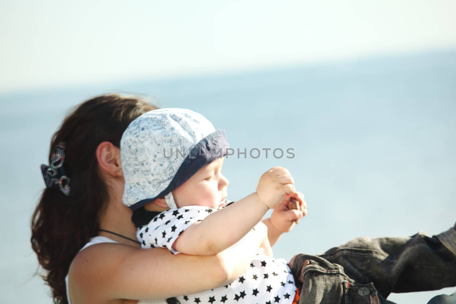 happy mother and son on picnic near sea