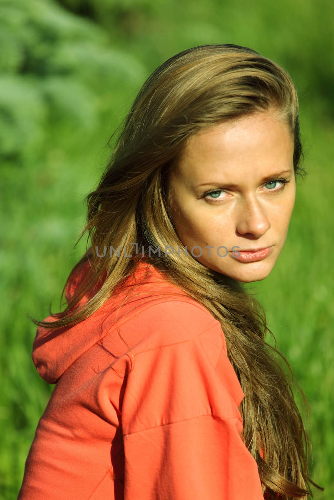 young sommer woman on green grass