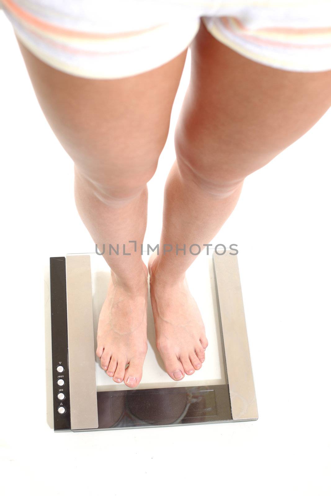 legs on scales isolated on white background