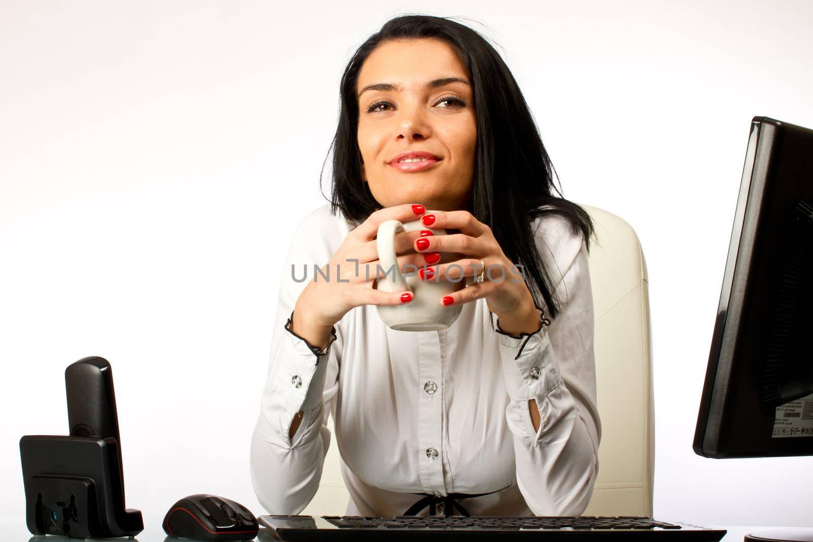 Office worker, secretary drinking coffee and relaxing on her desk