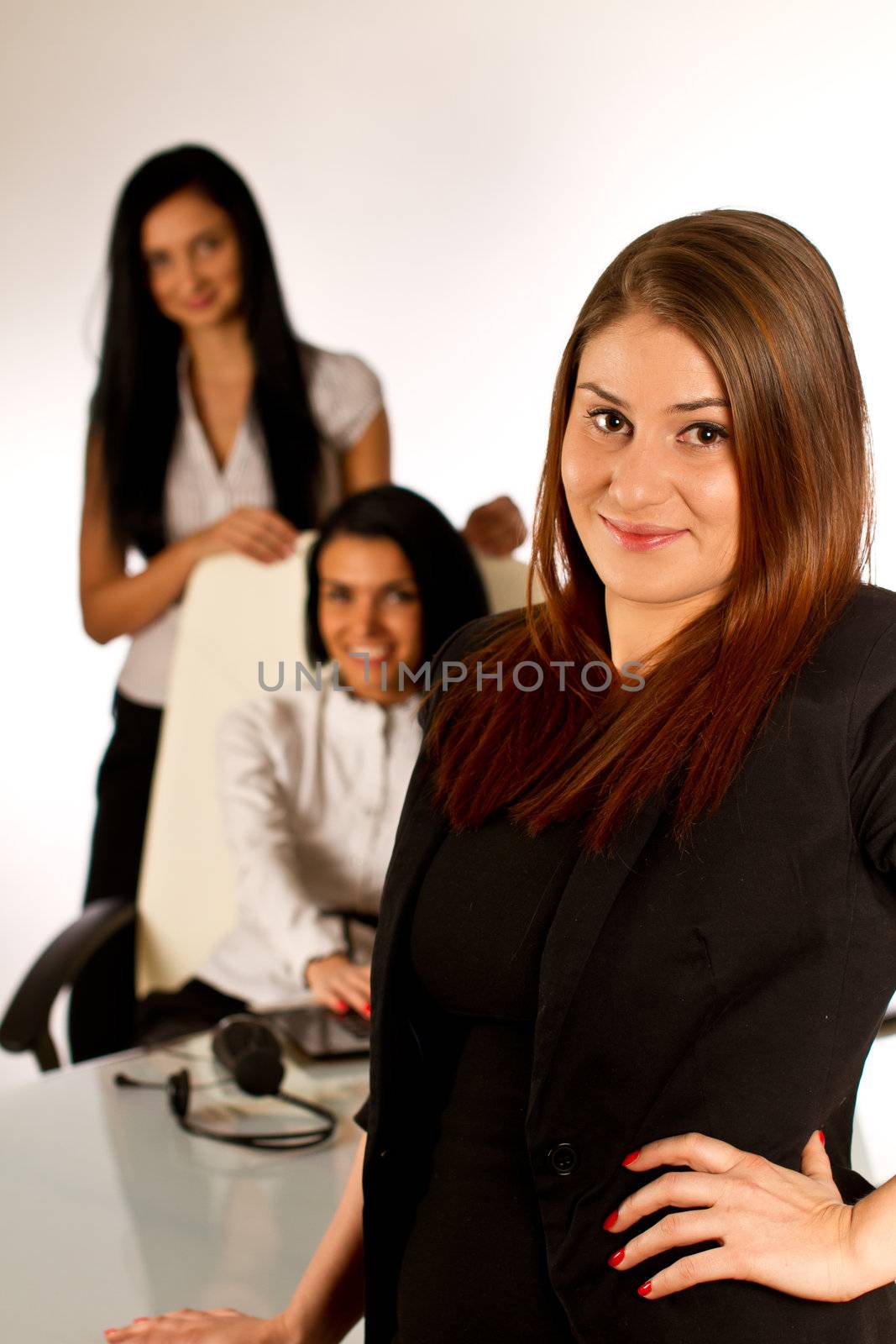 Three office women, secretary working together on a computer by tpfeller