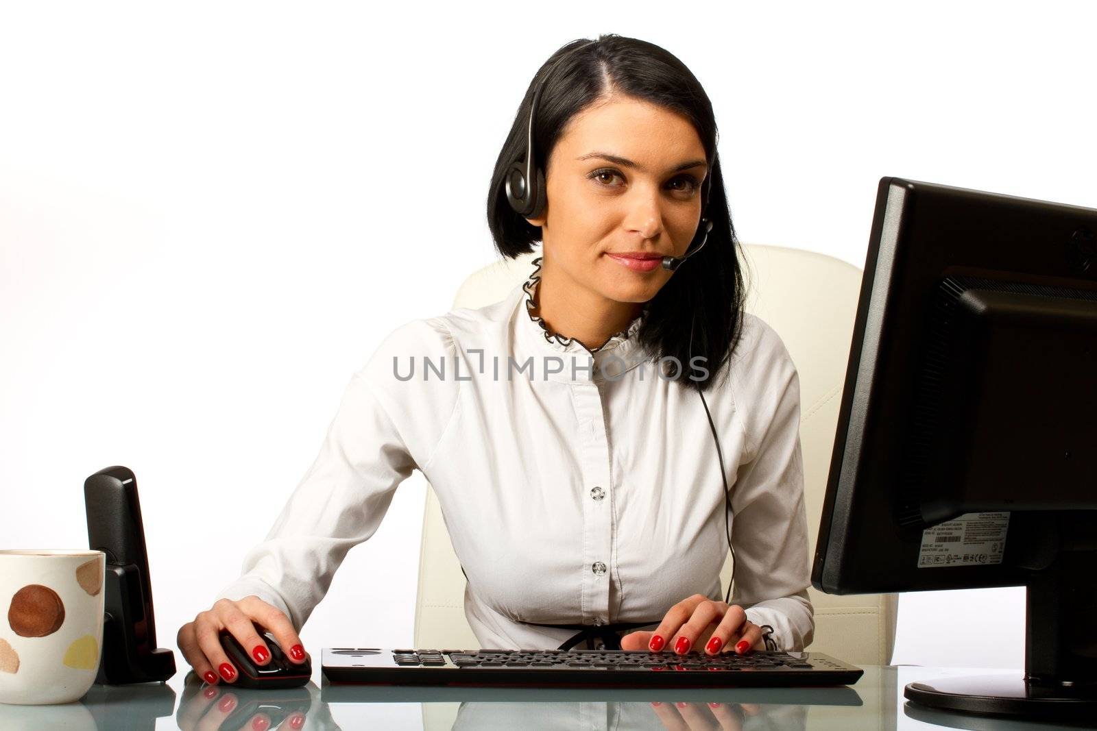 Office worker, secretary at her desk with headset by tpfeller