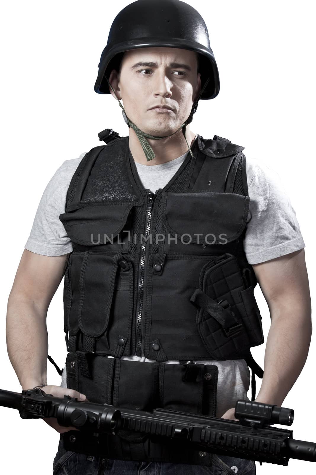 Armed man in protective cask with a pistol. Isolated on white.