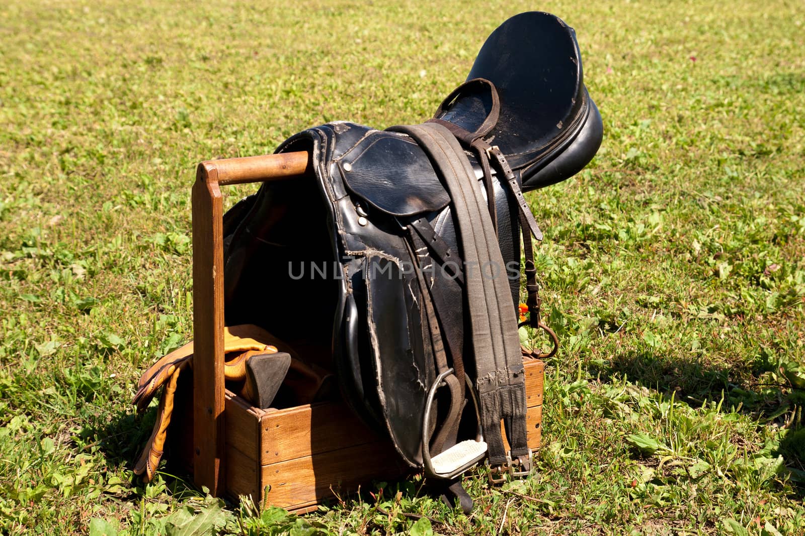 horse saddles waiting for sportsmen before the competition
