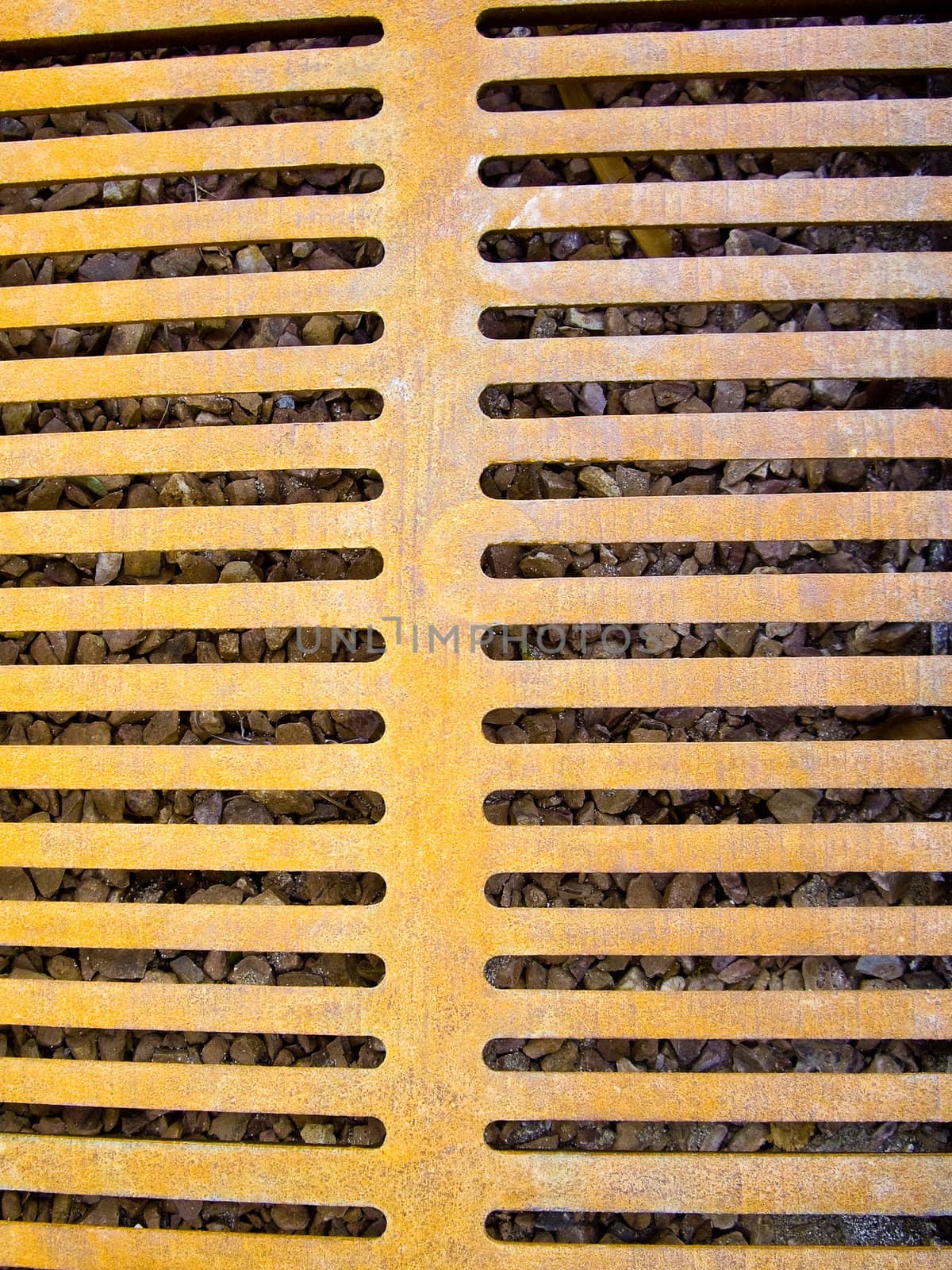 Yellowed ironwork on storm drain