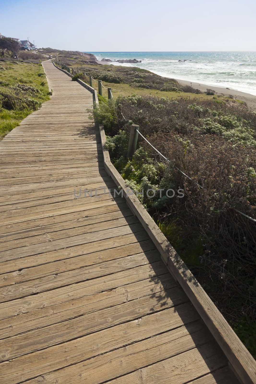 Wooden Walkway Along Ocean Coast Line.