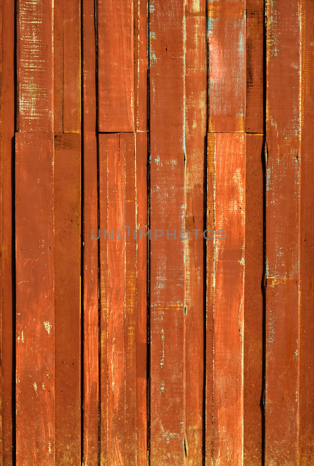 Texture of Orange color paint plank vertical wall for background