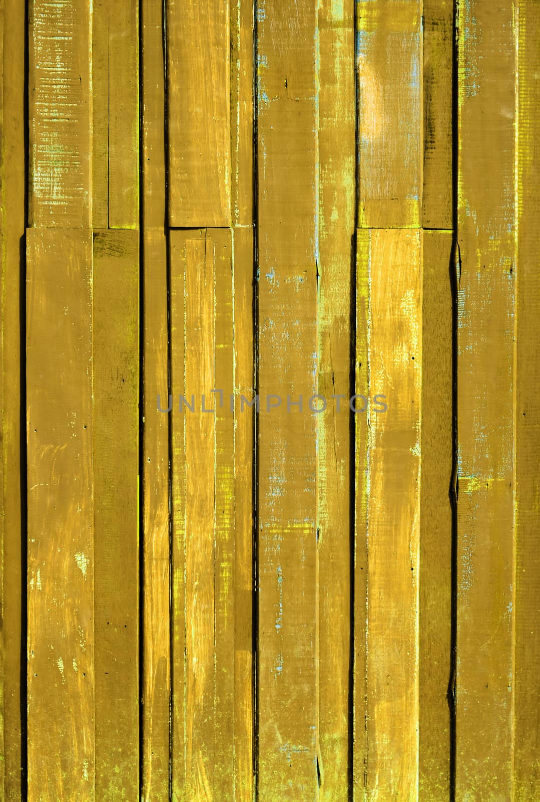 Texture of Yellow color paint plank vertical wall for background