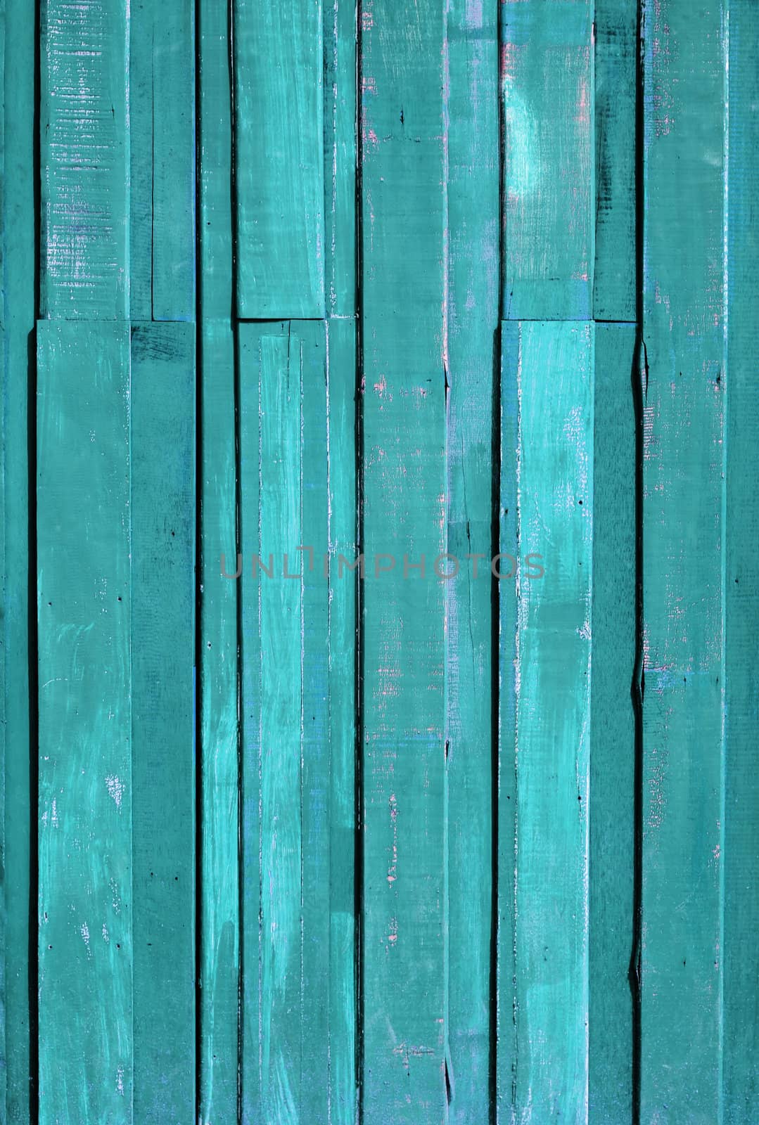 Texture of Green color paint plank vertical wall for background