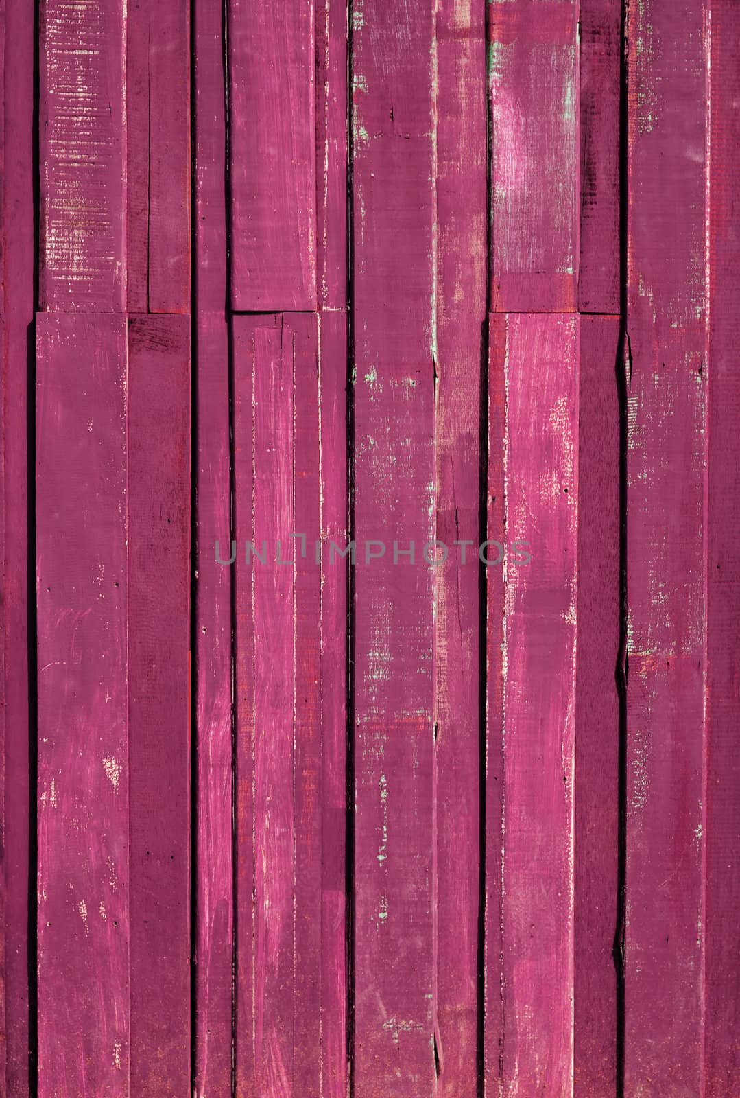 Texture of Pink color paint plank vertical by nuttakit