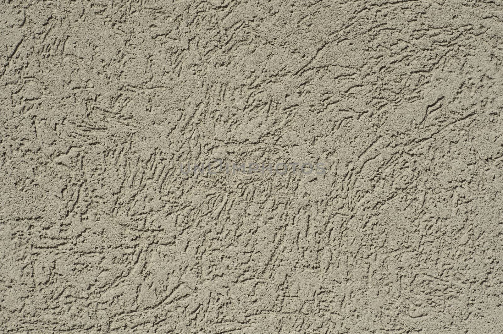 tan stucco texture for background usually found on a house or other building