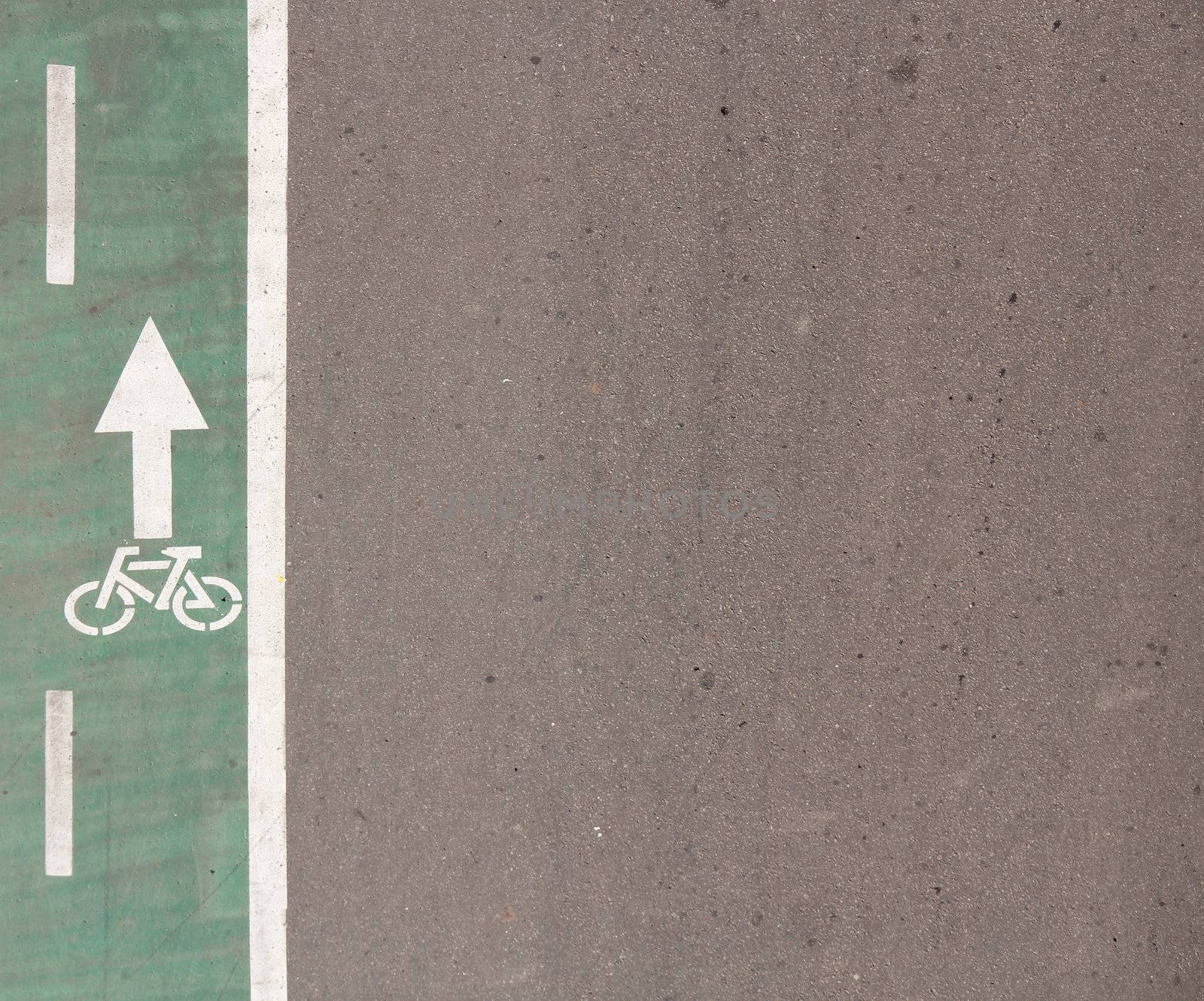 Green Bicycle Road with Sign and asphalt background