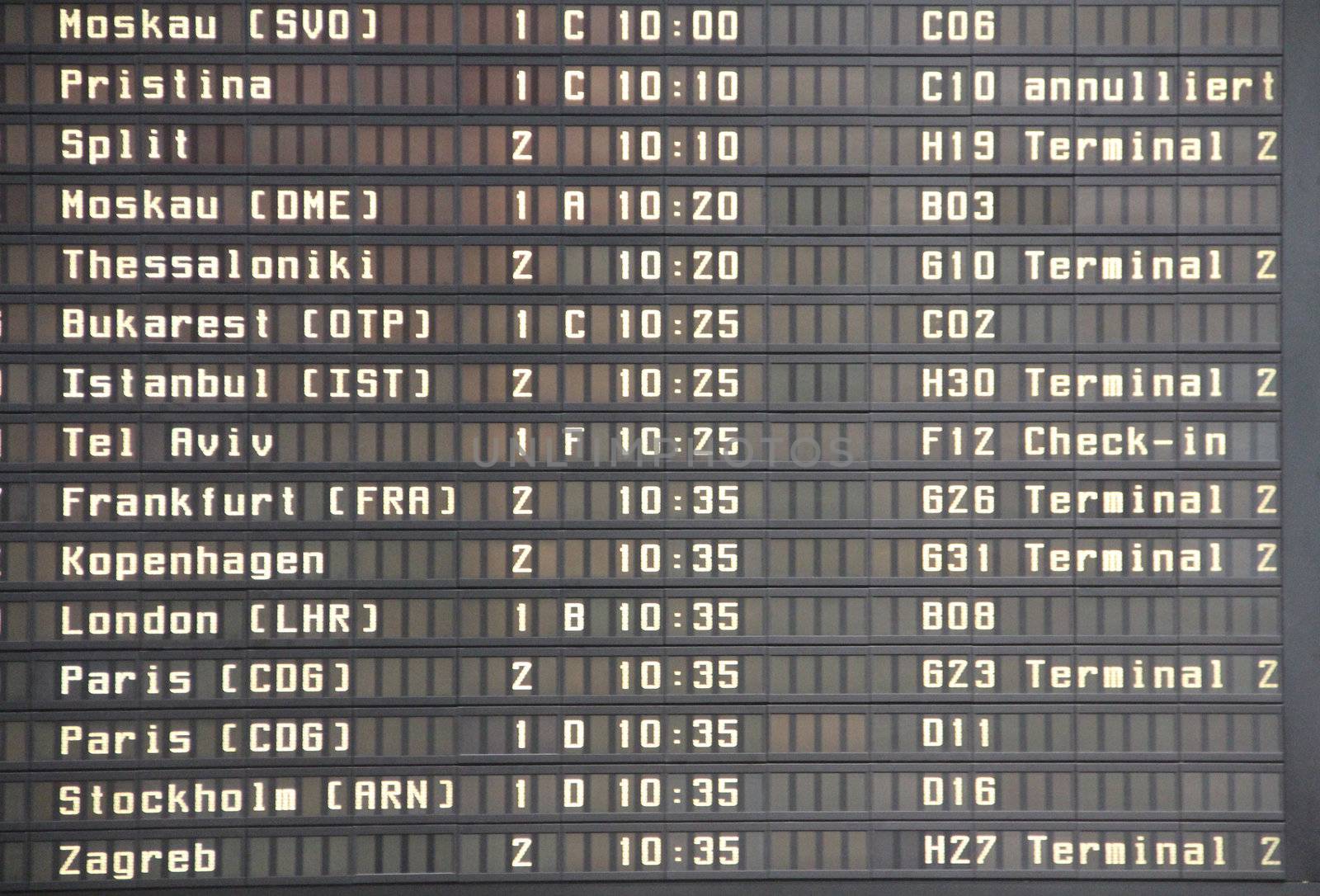 flight board with timetable of arrived planes
